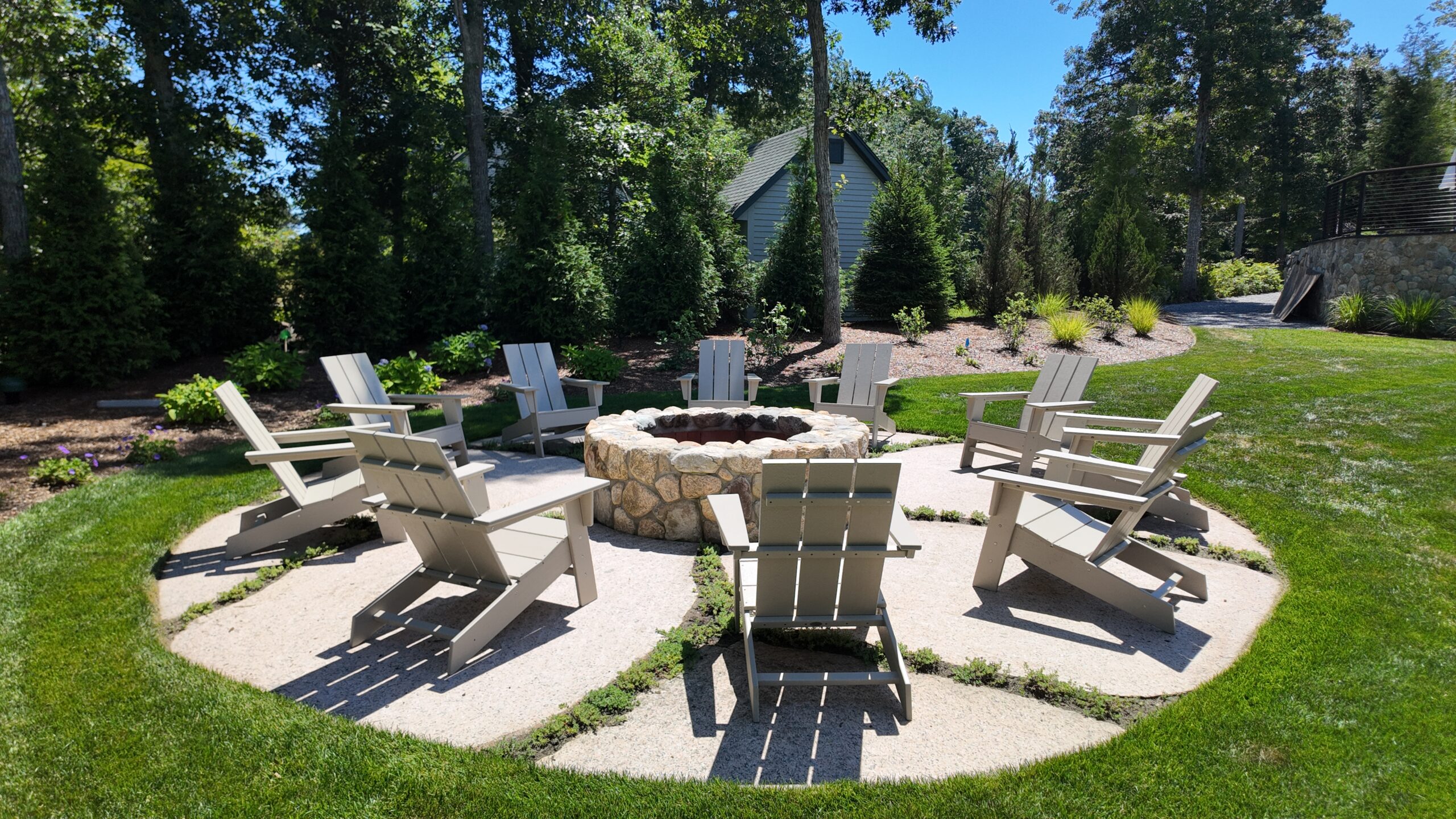Stone patio with fire pit and outdoor seating in Wareham, MA